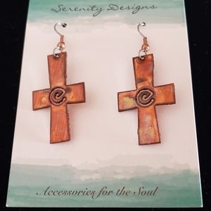 Copper cross earrings.